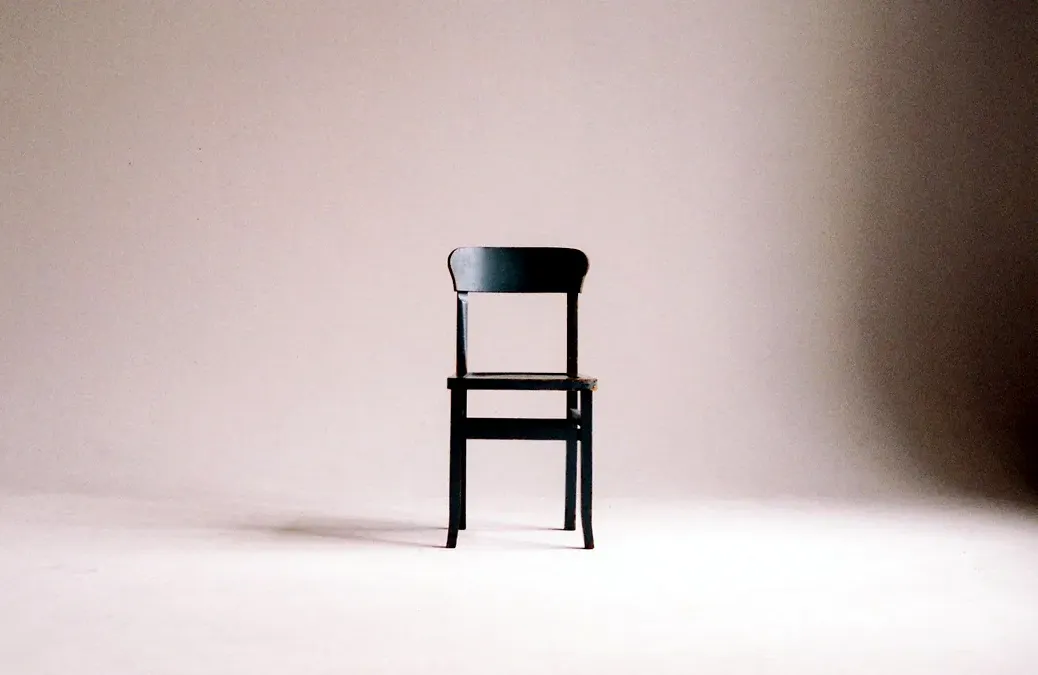 A chair photographed against a studio backdrop, exactly as the camera recorded it.
